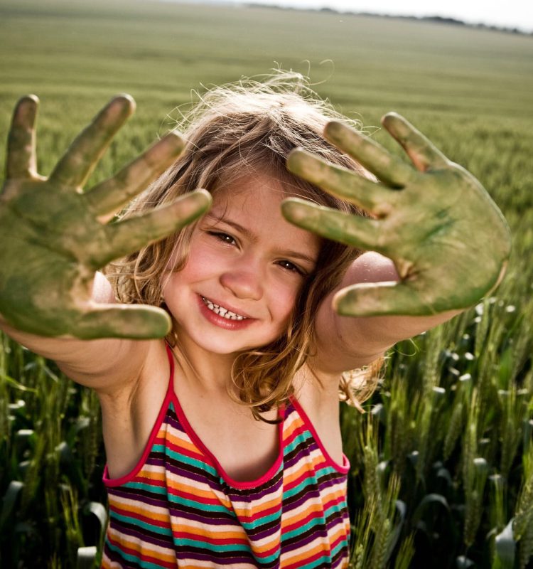 Girl with painted green hands